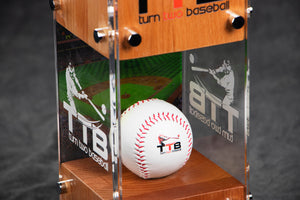 Close up photo of baseball inside glass trophy